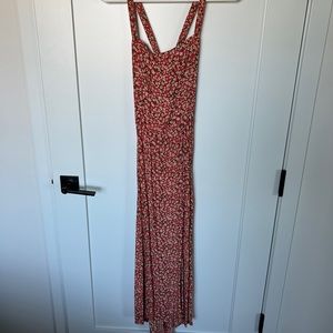 Faithfull the Brand orange floral dress.